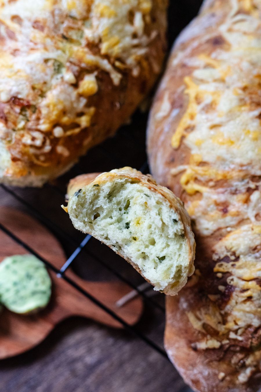 Cheddar-crusted loaves with green jalapeño flecks through the crumb